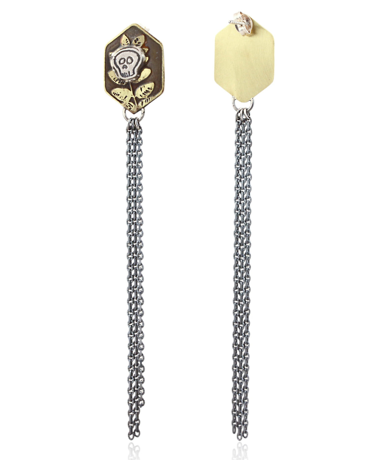 Pair of brass hexagon shaped earrings with skull designs and chain fringe details on a white background.