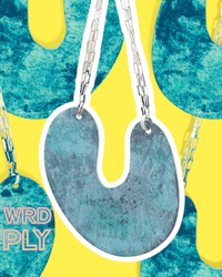 A blue earring with silver chains on a yellow and blue abstract background with 'WRD PLY' branding.