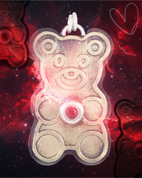 Gold teddy bear-shaped pendant with a red ruby gemstone on a red and black Nebula background