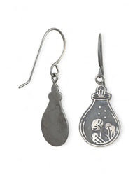 Silver earrings with a design of a potion bottle, with a crystal top, containing a mushrooms on a white background.