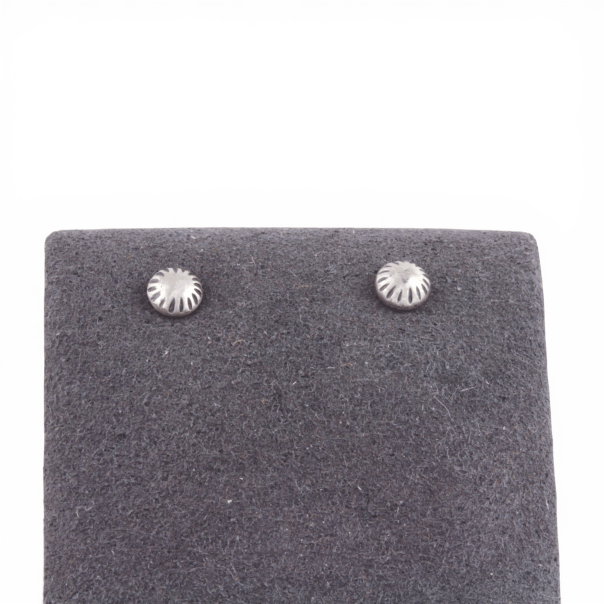 Pair of silver stud earrings on a gray felt earring pad.
