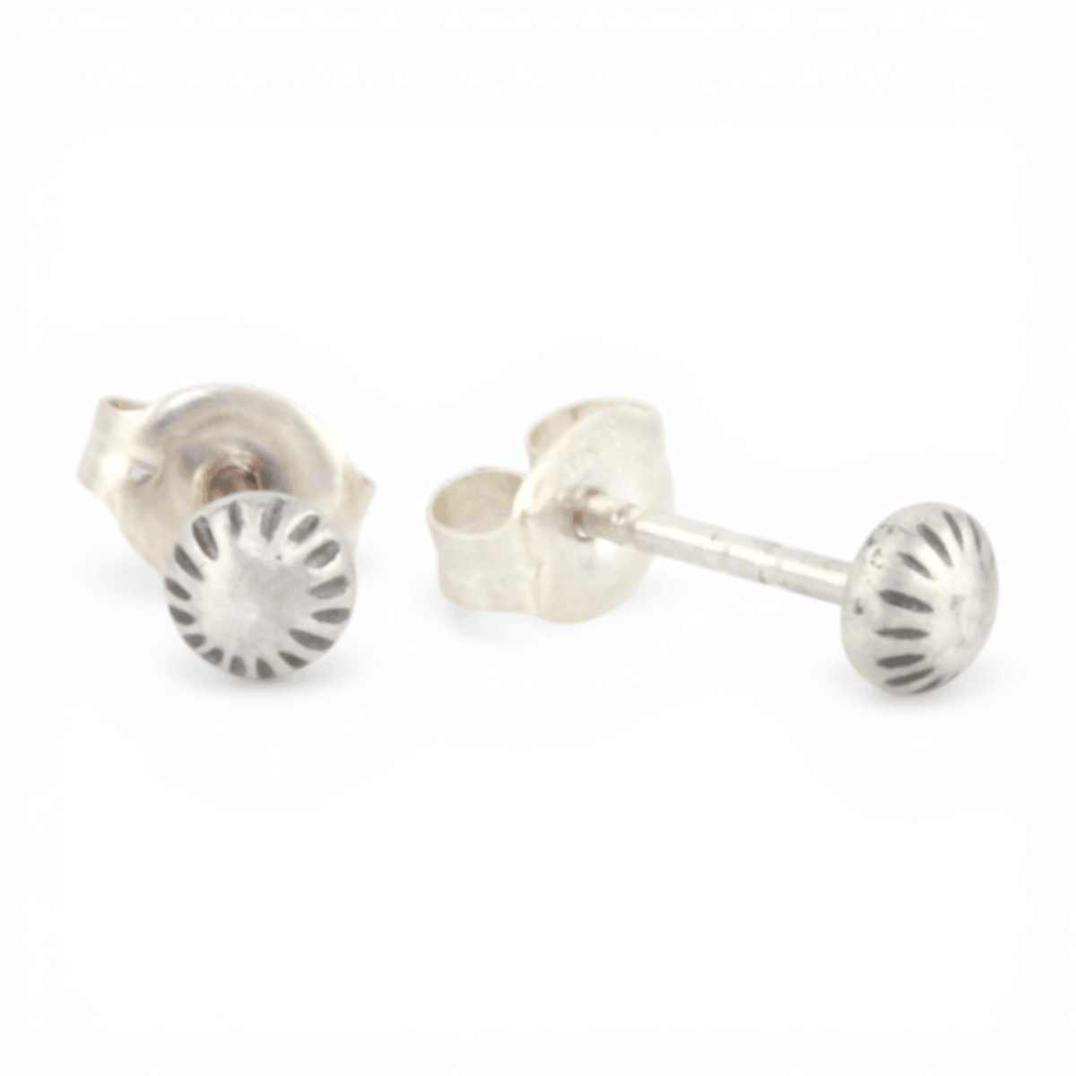 Pair of silver stud earrings on a white background