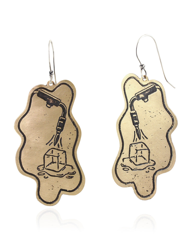 Pair of handmade and designed brass earrings with statement design on a white background. v1 Front.