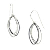 Two-toned abstract leaf dangle earrings in sterling silver, featuring oxidized and polished elements. V1