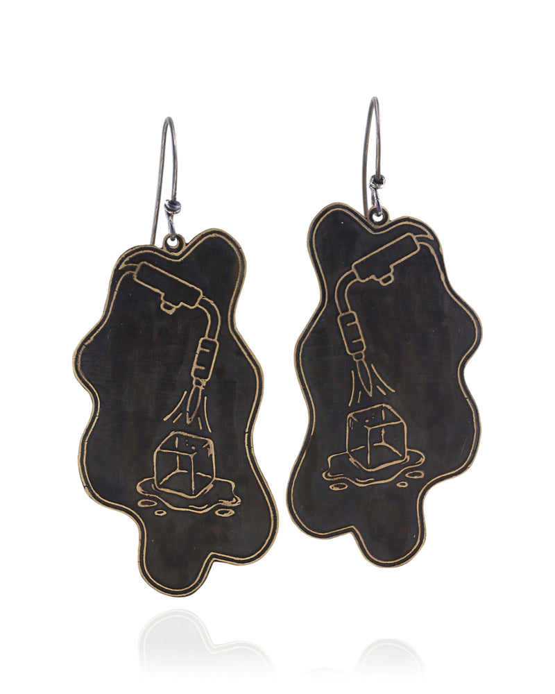 Pair of handmade and designed brass earrings with statement design on a white background. v4 Front.