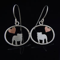 Sterling silver English Bulldog dangle earrings with copper heart inside oval frame, matte finish on black background.