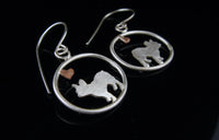 Sterling silver French Bulldog dangle earrings with copper heart inside oval frame, matte finish on black background.