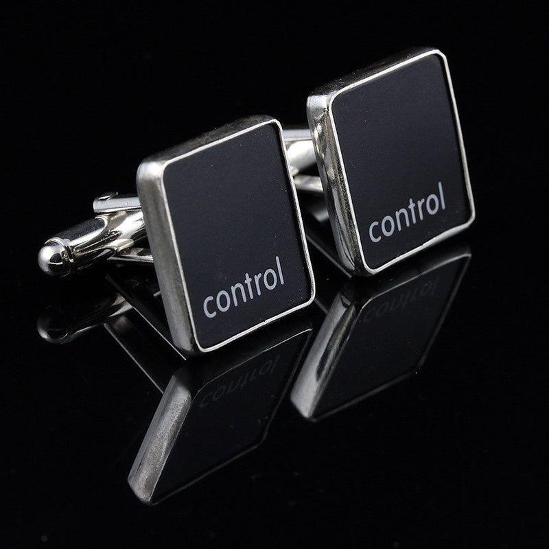 Pair of control key cufflinks made from repurposed Apple Macbook keyboard keys with silver bezel and polished finish.