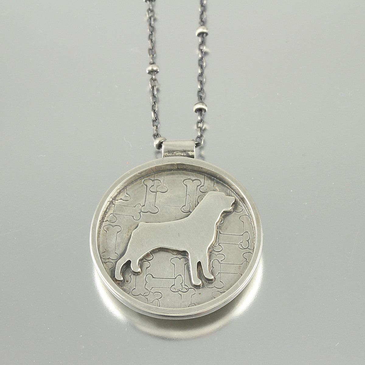 Handcrafted Sterling Silver Rottweiler Pendant for Dog Lovers. Front view