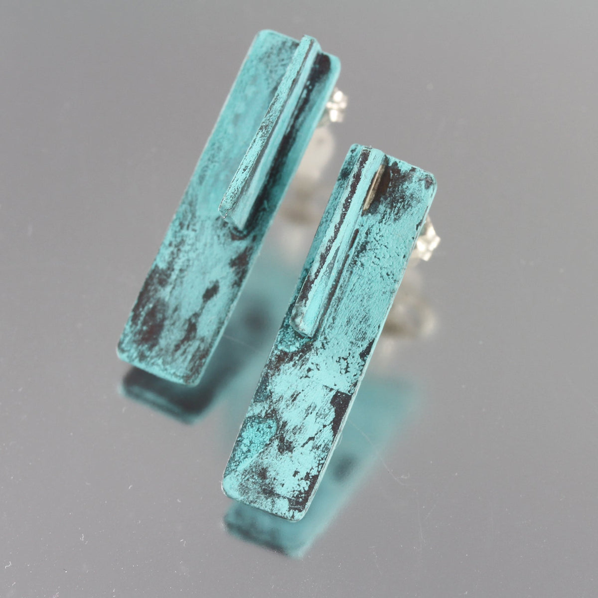 Handmade patina aqua blue abstract 3D earrings.