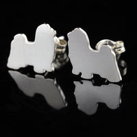 Silver Shih Tzu Long Haired dog-shaped earrings on a black background