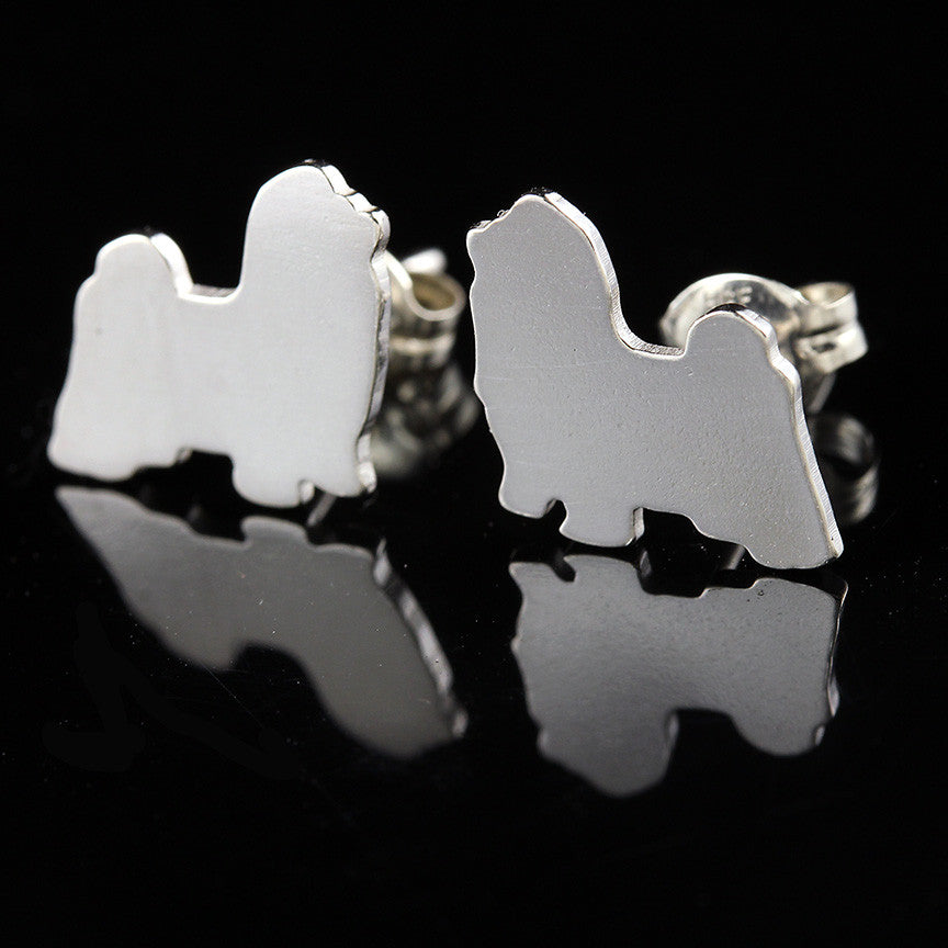 Silver Shih Tzu Long Haired dog-shaped earrings on a black background