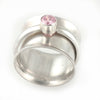 Sterling silver spinner ring with 5mm pink cubic zirconia, size 7.25 - front view