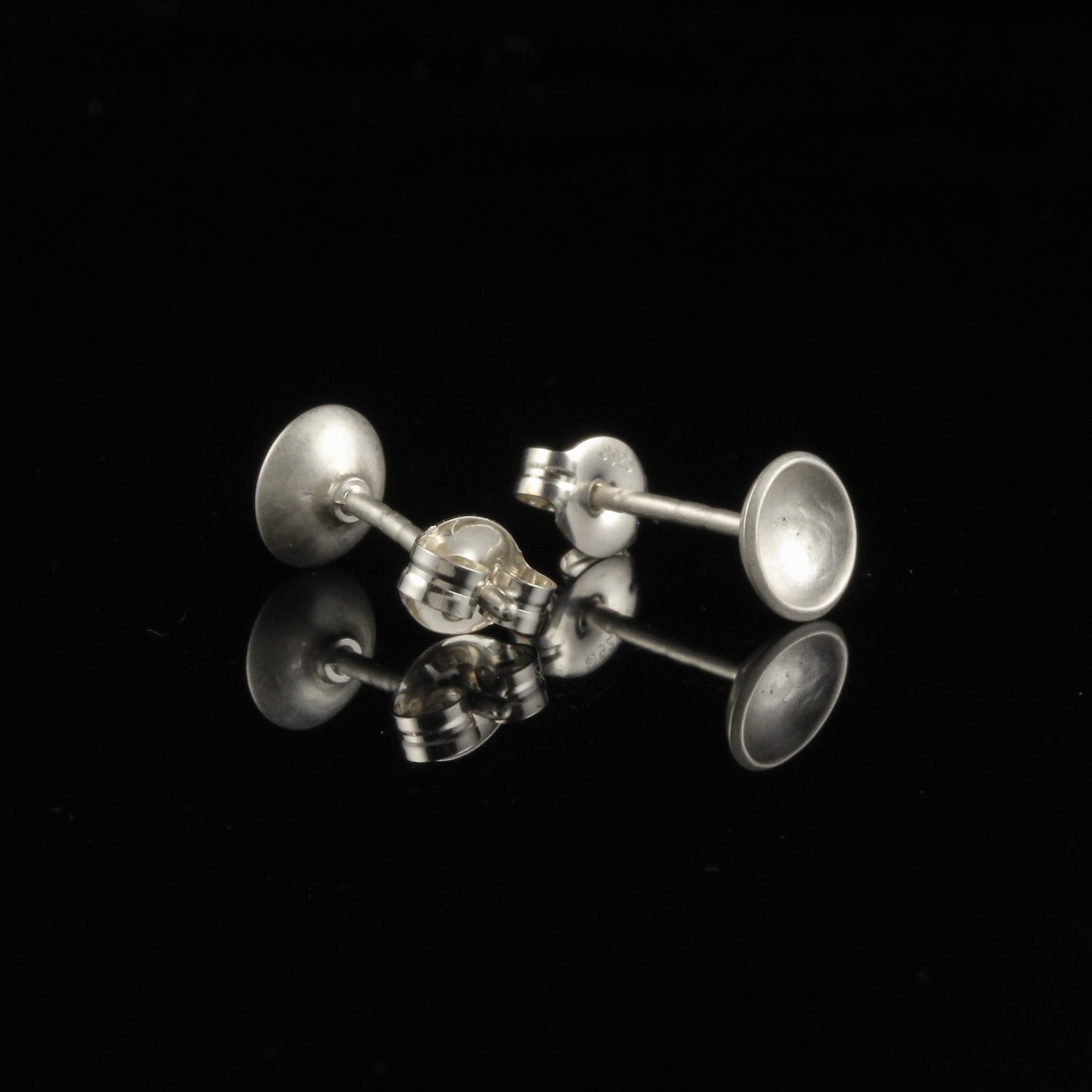 Handmade tiny domed cup sterling silver stud earrings - back and side view. 