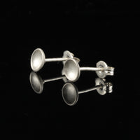 Handmade tiny domed cup sterling silver stud earrings - back and side view.