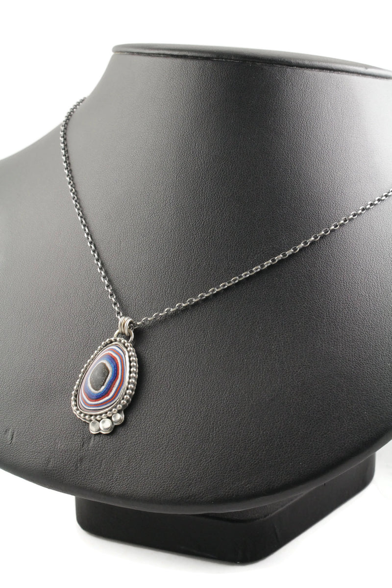 Red, Blue, White and Black Fordite Cab Pendant